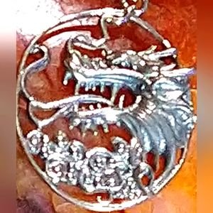 UNISEX-STERLING DRAGON PENDANT, SUSPENDED ON A 18" STERLING SILVER CHAIN.